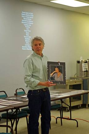 Photographer shares knowledge during presentation Photo by Chris Wyman Cinematographer/photographer Rob Haley holds a self-portrait created by Vernon photographer Terry Neff.
