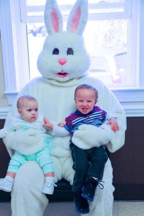 McKenzie Crowell and Jessica Regavich of Sussex visit with the Easter Bunny