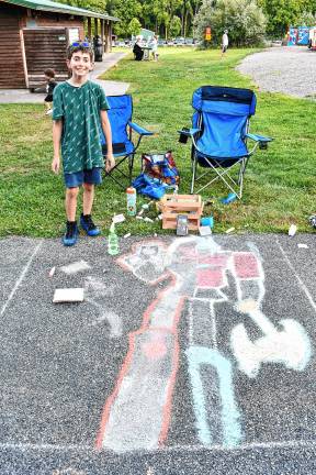 Photos: Sidewalk Chalk Art Festival in Vernon <b>Thomas Norberg of Vernon draws a transformer.</b>