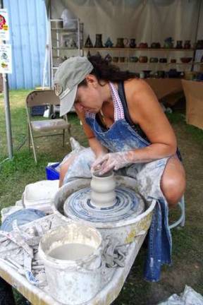 What would a fair be without arts and crafts? Potter Sharon Pflug of Newton is shown demonstrating the art of throwing a vessel made of clay at the New Jersey State Fair/Sussex County Farm and Horse Show.