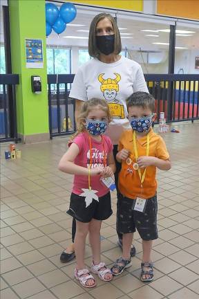 Principal Rosemary Gebhardt with two of her students (Photo by Vera Olinski)