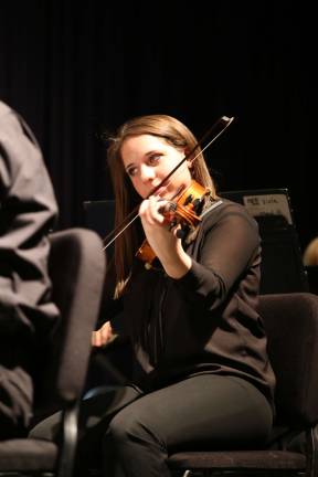 Vernon high school orchestra rehearses with pros Brittany Gaule on Viola