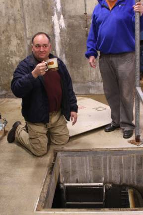 A look behind the scenes inside the water plant Plant manager Emil Coviello scoops up filtered water and shows that it is potable. Photos by Gale Miko