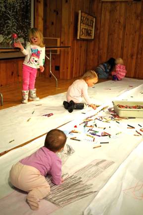 With hundreds of crayons available, the Seckler Stage at the Highland Lakes clubhouse was transformed into a jumbo coloring book for the young children to enjoy.