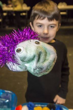 Jason Cahill, 8, of Vernon shows off his new sock puppet.