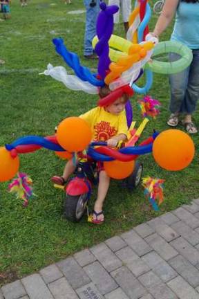 Sebastian Tobin, 3, got a lot of attention with his balloon bike during the bicycle decorating parade.