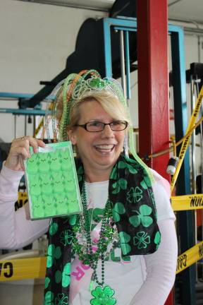 Lisaann Permunian of Wantage, N.J. &quot;10 year breast cancer survivor Lisaann Permunian had a Celebration of Life at the Sussex Fire Department's St. Baldricks Event on March 15. Here she is all in green getting ready to have her head shaved.&quot;