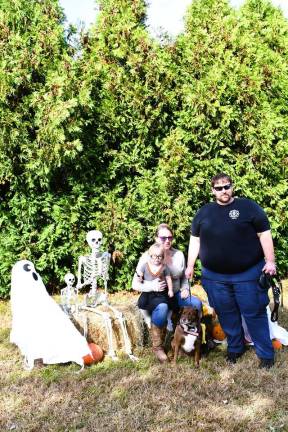 Vernon Dog Park hosts contest, parade <b>Charlie, Kelly and Sam Minnella of Hamburg are shown with their dog, Luna.</b>