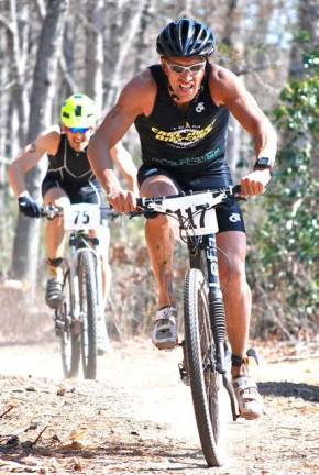 Hoffman's photography captures life through a lens Mountain bikers fly through the woods.