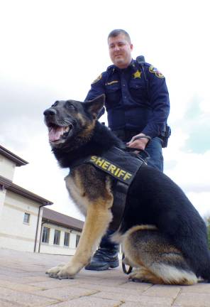 Sheriff's Office gives presentation on duties in county Photos by Chris Wyman Sheriff's Officer Kieran McMorrow with Atlas.