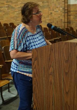 Susan Langan asks the Sussex-Wantage school board to consider three business office salaries of more than $241,000 in light of declining student enrollment. Photo by Vera Olinski.