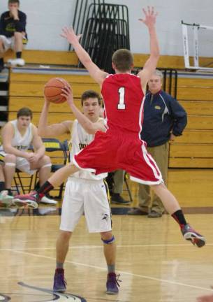 Vernon's Logan Costello looks to pass the ball while being covered by Lakeland's Steven Cook.
