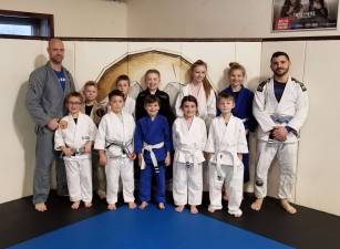 Coaches Moe and Joe with some of the newly promoted students (Back, L-R: Maurice Johnson, Dexter Liddle, Mason Reed, Josh Enberg, Caitlin Frey, Kristin Frey, Joe Tizzano; Front, L-R: Anthony Reyes, Lincoln Andres, Connor Frey, Sophia DeNapoli, Nolan Reed)