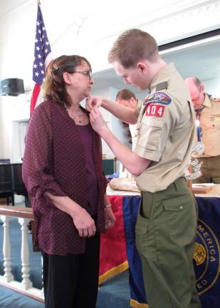 New Eagle scout Steven Schneider, 18, recognizes his mother, Laura Schneider for her role in helping him accomplish the rank of Eagle Scout.