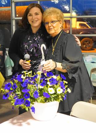From left, Vernon Chamber of Commerce Vice President Jennifer Hopper presents a flowering plant to Andrea Cocula.