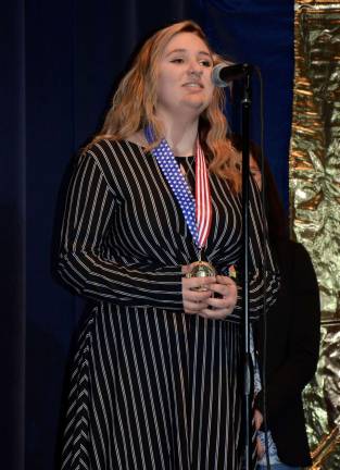 VTHS students shine in annual poetry contest Sidney Sparta recites “And Soul” for the audience after being awarded the First Place medal out of 80 competitors.