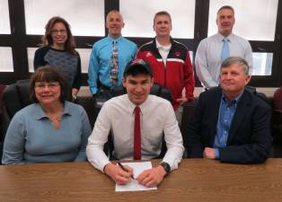 High Point's Garret Potter, seated middle, sign his National Letter of Intent to continue his soccer career at Rider University. Pictured are, from left, mother Suzanne Potter, Garret Potter, and father Warren Potter. Standing from left to right are, Vice Principals Amy Librizzi, Erik Carlson, Head Boys Soccer Coach Kevin Fenlon, and Athletic Director Todd Van Orden.
