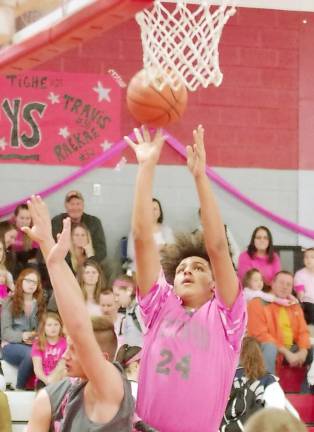 Vernon's Andre Pierce (24) throws the ball towards the basket during a shot in the second quarter of a game last season.