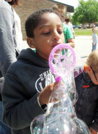 Photo by Viktoria-Leigh Wagner First-grader Zachary Brouard blows a bubble.