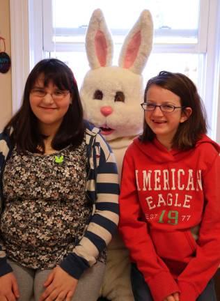 McKenzie Crowell and Jessica Regavich of Sussex help the Easter Bunny with visitors at the Sussex firehouse breakfast.