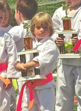 Vernon Valley Karate holds Vernon Day demonstration Nickolaus Hefner shows off his trophy.