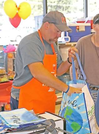 Fred Babcock from the Franklin Fire Department takes his role as bagger very seriously