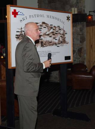 Senior Patrol Leader Paul Bruno unveiled the Ski Patrol Memorial Plaque during the 50th Anniversary celebration of the Mountain Creek Ski Patrol.