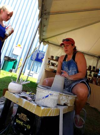 Newton-based potter and ceramic artist Sharon Pflug-Moench was on hand to throw and the carve clay vessels.