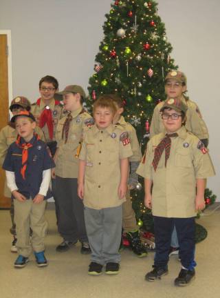 The scouts of Pack 404 and Troop 912 belt out their version of Jingle Bells to a pleased group at the Vernon Senior Center on Dec. 30.