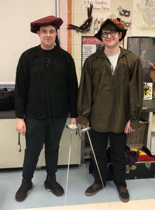 Alex Amato, left, and Nathan Fitch wrote and performed a skit in Elizabethan English and performed a carefully choreographed sword fight with fencing sabers.