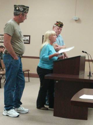 Photo by Leigh Tenore Sally Rinker, center, speaks to the Vernon Township Council. Flanking her are, left, Bob Constantine, past commander of the Wallkill Valley VFW Post 6441, and member Russ Toms, right.