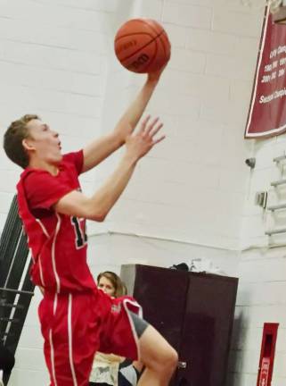 High Point's Jack DeGroot rises towards the hoop with the ball.