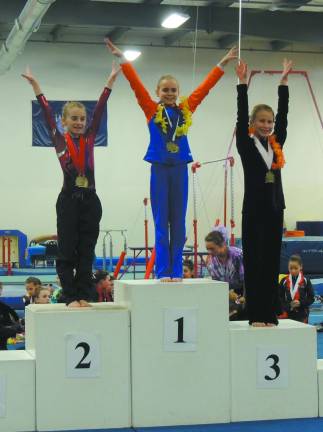 Giant gymnasts win medals in Florida Reese Abrams of Sparta taks first place for floor exercises.