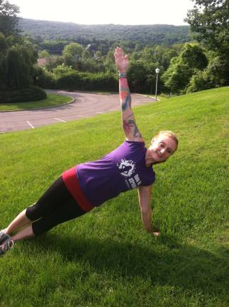 Photo by Claudia Caramiello Certified Master Trainer, Jessica Sharry Dransfield of Lafayette demonstrates the Star Fish pose.