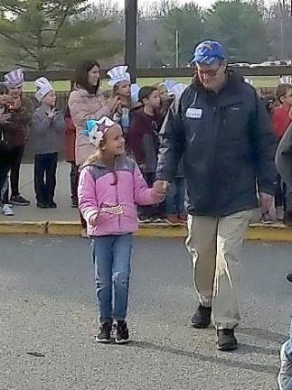 Cedar Mountain Student walks with her grandfather, Veteran Tom Peters.