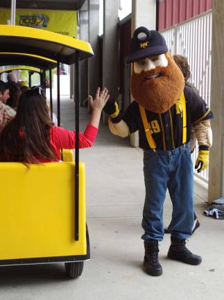 Herbie the Miner, the official mascot the Sussex County Miners baseball team, offered high fives to passengers of the stadium's passenger train.