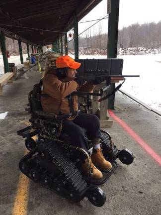 Refuge offers hunting chance for disabled sportsmen Michael Payne sights in his gun.