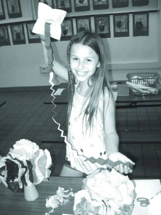 Paper Sculptures take center stage at Family Art Night Jennifer Marcinkowski and her puppet.