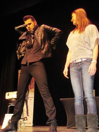 Joel Meyer performs at SCCC Magician Joel Meyers gets an assist from SCCC criminal justice major Jamie Woods, 20, of Vernon.