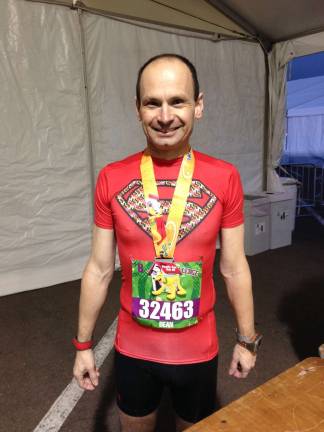 Locals go a little Dopey for Disney World races Marathon runner, Dean Giering, 47 of Newton sported a different superhero shirt for each race.
