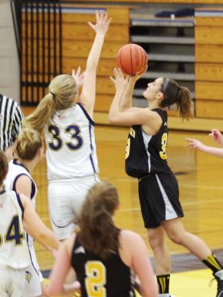 Vernon's Samantha Dulmer attempts to block West Milford's Aly Roskowsky's shot.