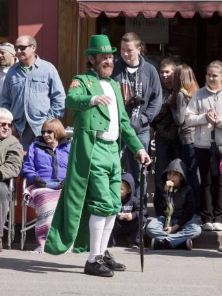 Newton goes green A local fire fighter dressed as a leprechaun.