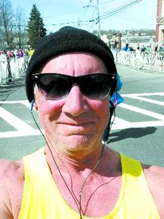 Locals finish strong at Boston Marathon Karl Fenske snaps a photot while running the Boston Marathon.