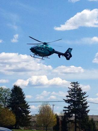 The Atlantic Air One Helicopter landed with precision on the college lawn in front of Sussex County Day to demonstrate how an air lift works when someone is hurt or sick.