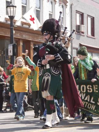 Marchers from St Josephs Regional School in Newton are led by an unidentified bagpiper.