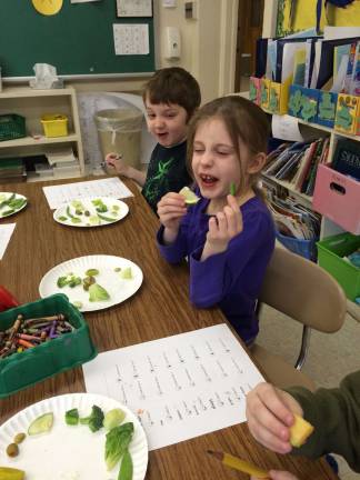Franklin students taste their greens Kaylee Davis and Michael Haase