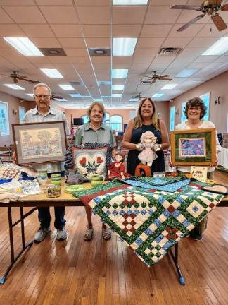 Lord’s Auction on Saturday at church <b>From left, Richard and Barbara Gardiner, Chris Delnero and Barbara Morgan with items for the 78th annual Lord’s Auction on Saturday, Aug. 30. (Photo provided)</b>