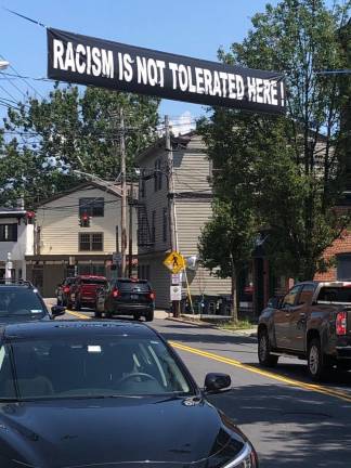 Residents see ‘coded racism’ in firehouse sign A banner over West Street. After receiving calls about a pro-police banner, the Village of Warwick is considering limiting banners to local event promotion to avoid a banner war.