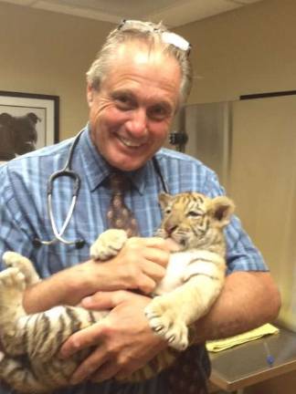Sussex County dogs getting sick despite vaccines Ted Spinks, DVM, with a non-canine patient Straus file photo