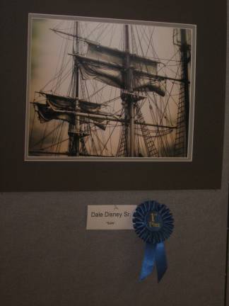 Sails, a photo by Dale Disney, won first place adult division of the Historical Society's weekend exhibition.